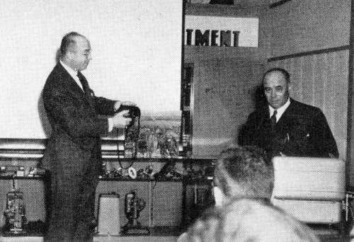 Rudolph Simmon (left) demonstrates the Omega 120 at the MPDFA Chicago, March 1954